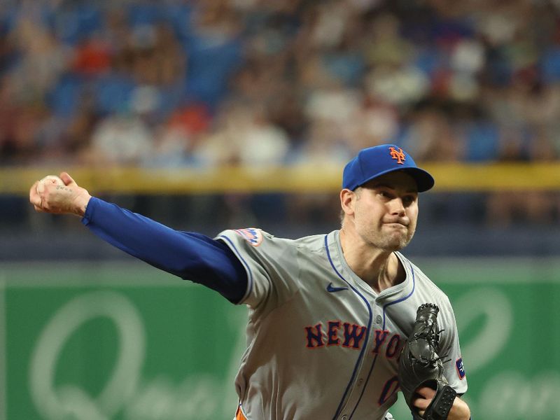 May 4, 2024; St. Petersburg, Florida, USA;  New York Mets pitcher Adam Ottavino (0) throws a pitch against the Tampa Bay Rays during the eighth inning at Tropicana Field. Mandatory Credit: Kim Klement Neitzel-USA TODAY Sports