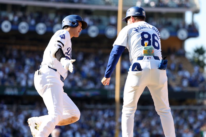 Sep 22, 2024; Los Angeles, California, USA;  Los Angeles Dodgers designated hitter Shohei Ohtani (17) celebrates with first base coach Clayton McCullough (86) after hitting a game tying solo home run during the ninth inning against the Colorado Rockies at Dodger Stadium. Mandatory Credit: Kiyoshi Mio-Imagn Images