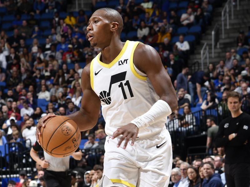 ORLANDO, FL - FEBRUARY 29: Kris Dunn #11 of the Utah Jazz handles the ball during the game against the Orlando Magic on February 29, 2024 at Amway Center in Orlando, Florida. NOTE TO USER: User expressly acknowledges and agrees that, by downloading and or using this photograph, User is consenting to the terms and conditions of the Getty Images License Agreement. Mandatory Copyright Notice: Copyright 2024 NBAE (Photo by Fernando Medina/NBAE via Getty Images)