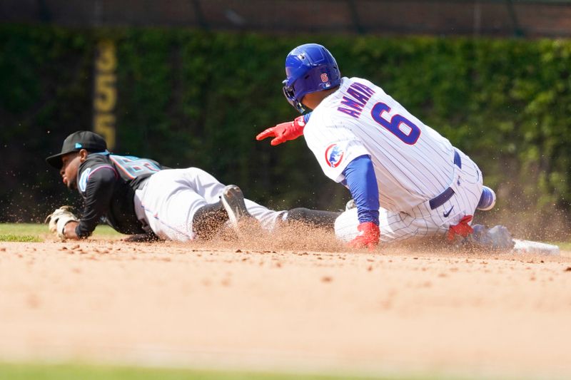 May 6, 2023; Chicago, Illinois, USA; Miami Marlins second baseman Xavier Edwards (63) forces out Chicago Cubs pinch-hitter Miguel Amaya (6) at second base during the eighth inning at Wrigley Field. Mandatory Credit: David Banks-USA TODAY Sports