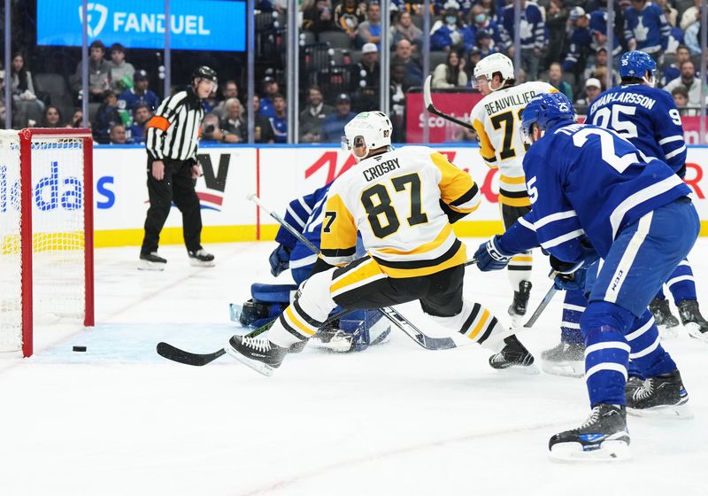 Oct 12, 2024; Toronto, Ontario, CAN; Pittsburgh Penguins center Sidney Crosby (87) battles for the puck in front of the Toronto Maple Leafs net during the second period at Scotiabank Arena. Mandatory Credit: Nick Turchiaro-Imagn Images