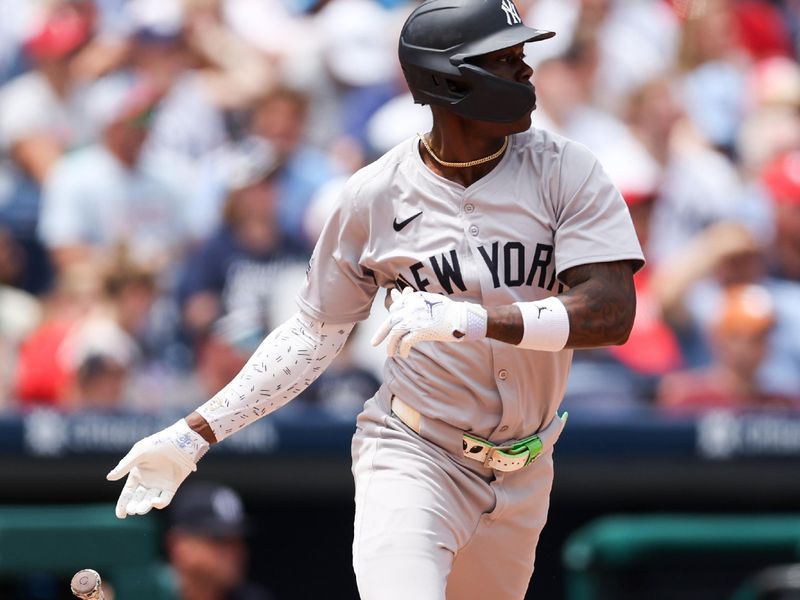 Jul 31, 2024; Philadelphia, Pennsylvania, USA;  New York Yankees third base Jazz Chisholm Jr. (13) hits a single during the second inning against the Philadelphia Phillies at Citizens Bank Park. Mandatory Credit: Bill Streicher-USA TODAY Sports