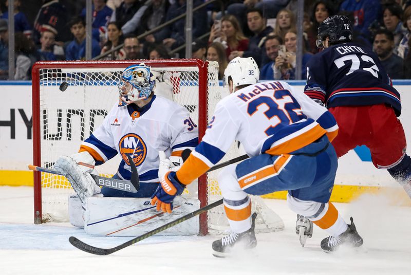 Nov 3, 2024; New York, New York, USA; New York Rangers center Filip Chytil (72) hits the post on a shot that beat New York Islanders goalie Ilya Sorokin (30) but glanced off his helmet and back into play during the first period at Madison Square Garden. Mandatory Credit: Danny Wild-Imagn Images