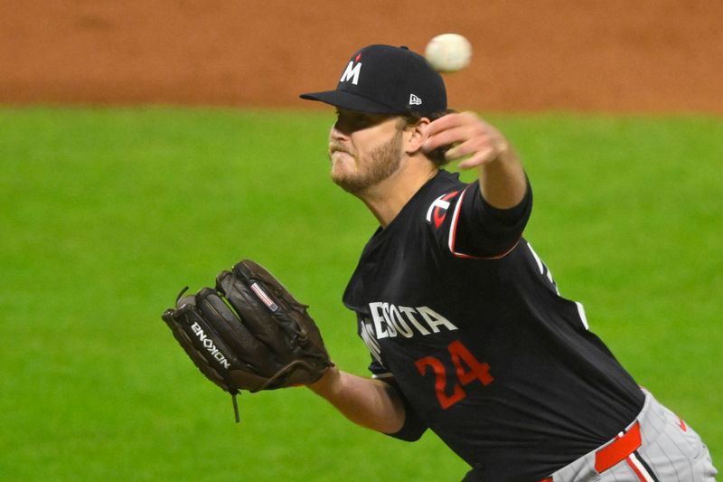 Sep 17, 2024; Cleveland, Ohio, USA; Minnesota Twins starting pitcher Cole Irvin (24) delivers a pitch in the fifth inning against the Cleveland Guardians at Progressive Field. Mandatory Credit: David Richard-Imagn Images