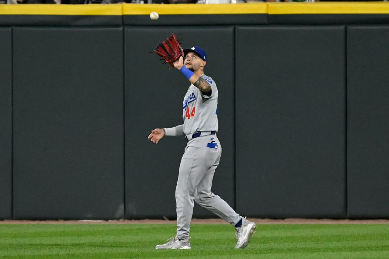 Jun 24, 2024; Chicago, Illinois, USA;  Los Angeles Dodgers outfielder Andy Pages (44) catches a fly ball hit by Chicago White Sox third base Lenyn Sosa (50) during the fourth inning at Guaranteed Rate Field. Mandatory Credit: Matt Marton-USA TODAY Sports