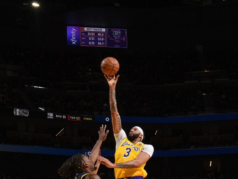 SAN FRANCISCO, CA - FEBRUARY 22:  Anthony Davis #3 of the Los Angeles Lakers goes to the basket during the game on February 22, 2024 at Chase Center in San Francisco, California. NOTE TO USER: User expressly acknowledges and agrees that, by downloading and or using this photograph, user is consenting to the terms and conditions of Getty Images License Agreement. Mandatory Copyright Notice: Copyright 2024 NBAE (Photo by Noah Graham/NBAE via Getty Images)