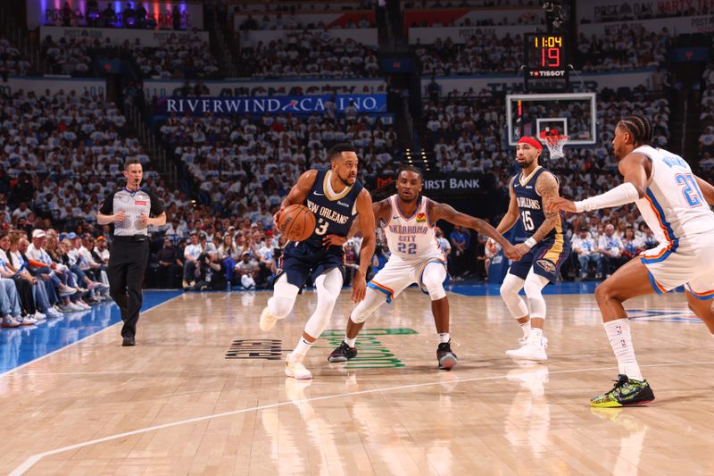 OKLAHOMA CITY, OK - APRIL 21:  CJ McCollum #3 of the New Orleans Pelicans handles the ball during the game  against the Oklahoma City Thunder during Round 1 Game 1 of the 2024 NBA Playoffs on April 21, 2024 at Paycom Arena in Oklahoma City, Oklahoma. NOTE TO USER: User expressly acknowledges and agrees that, by downloading and or using this photograph, User is consenting to the terms and conditions of the Getty Images License Agreement. Mandatory Copyright Notice: Copyright 2024 NBAE (Photo by Zach Beeker/NBAE via Getty Images)