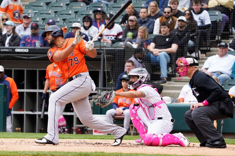 May 14, 2023; Chicago, Illinois, USA; Houston Astros first baseman Jose Abreu (79) hits a single against the Chicago White Sox during the first inning at Guaranteed Rate Field. Mandatory Credit: David Banks-USA TODAY Sports