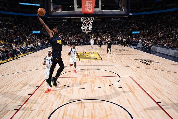 DENVER, CO - DECEMBER 18: Peyton Watson #8 of the Denver Nuggets drives to the basket during the game against the Dallas Mavericks on December 18, 2023 at the Ball Arena in Denver, Colorado. NOTE TO USER: User expressly acknowledges and agrees that, by downloading and/or using this Photograph, user is consenting to the terms and conditions of the Getty Images License Agreement. Mandatory Copyright Notice: Copyright 2023 NBAE (Photo by Garrett Ellwood/NBAE via Getty Images)