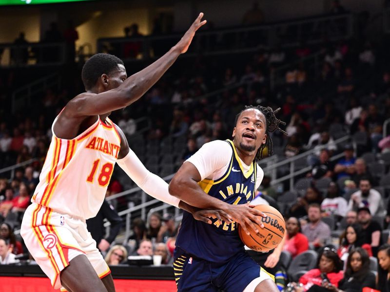 ATLANTA, GA - OCTOBER 8: Tristen Newton #4 of the Indiana Pacers drives to the basket during the game against the Atlanta Hawks during a NBA preseason game on October 8, 2024 at State Farm Arena in Atlanta, Georgia.  NOTE TO USER: User expressly acknowledges and agrees that, by downloading and/or using this Photograph, user is consenting to the terms and conditions of the Getty Images License Agreement. Mandatory Copyright Notice: Copyright 2024 NBAE (Photo by Adam Hagy/NBAE via Getty Images)