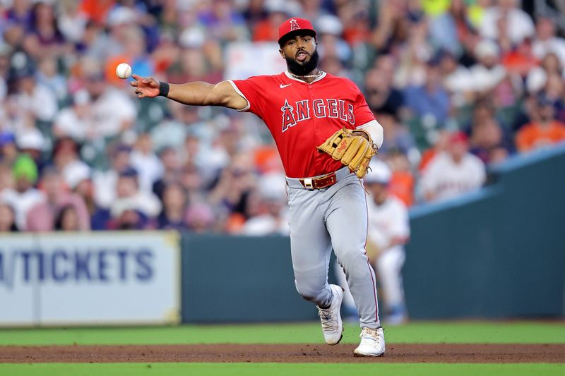 Apr 13, 2025; Houston, Texas, USA; Los Angeles Angels third baseman Luis Rengifo (2) throws the ball to first base for an out against the Houston Astros during the fifth inning at Daikin Park. Mandatory Credit: Erik Williams-Imagn Images