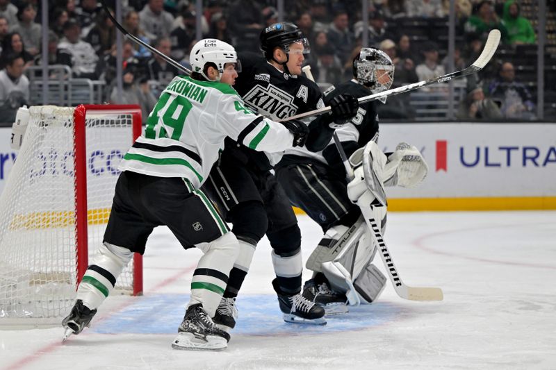 Jan 12, 2026; Los Angeles, California, USA;  Dallas Stars center Justin Hryckowian (49) and Los Angeles Kings defenseman Mikey Anderson (44) fight for position in front of the net in the first period at Crypto.com Arena. Mandatory Credit: Jayne Kamin-Oncea-Imagn Images