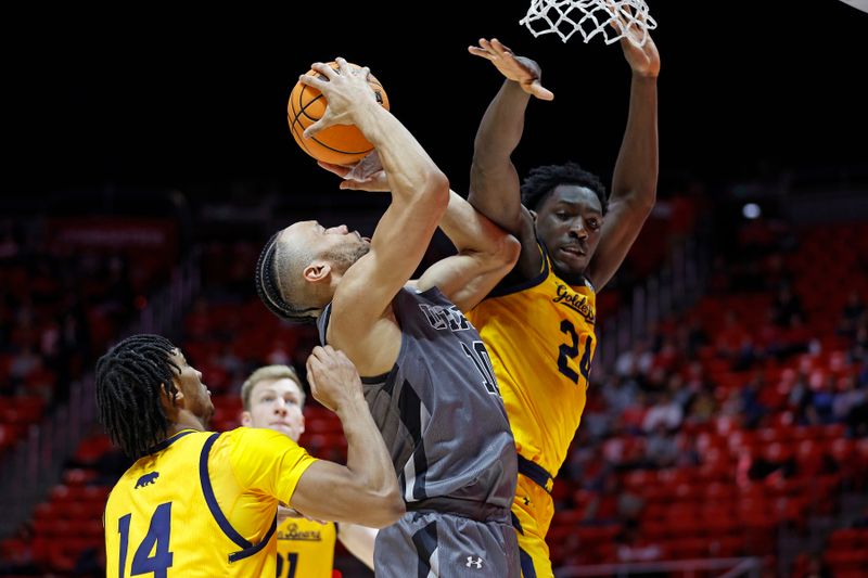 Feb 5, 2023; Salt Lake City, Utah, USA; Utah Utes guard Marco Anthony (10) shoots against California Golden Bears forward Grant Newell (14) and California Golden Bears forward Sam Alajiki (24) in the second half at Jon M. Huntsman Center. Mandatory Credit: Jeffrey Swinger-USA TODAY Sports