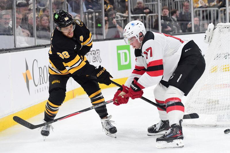 Apr 14, 2026; Boston, Massachusetts, USA; Boston Bruins right wing David Pastrnak (88) passes the puck in front of the net past New Jersey Devils defenseman Simon Nemec (17) during the third period at TD Garden. Mandatory Credit: Bob DeChiara-Imagn Images Apr 14, 2026; Boston, Massachusetts, USA; Boston Bruins right wing David Pastrnak (88) passes the puck in front of the net past New Jersey Devils defenseman Simon Nemec (17) during the third period at TD Garden. Mandatory Credit: Bob DeChiara-Imagn Images