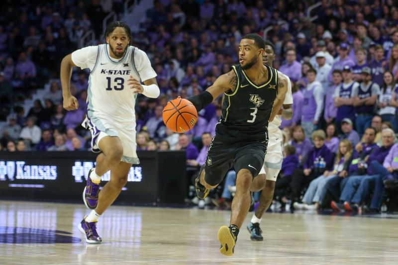 Jan 6, 2024; Manhattan, Kansas, USA; UCF Knights guard Darius Johnson (3) runs away from Kansas State Wildcats center Will McNair Jr. (13 and guard Cam Carter (5) during the second half at Bramlage Coliseum. Mandatory Credit: Scott Sewell-USA TODAY Sports