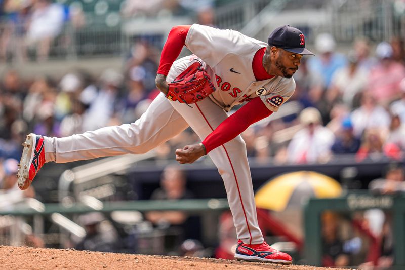 Jun 1, 2025; Cumberland, Georgia, USA; Boston Red Sox relief pitcher Aroldis Chapman (44) pitches against the Atlanta Braves during the ninth inning at Truist Park. Mandatory Credit: Dale Zanine-Imagn Images