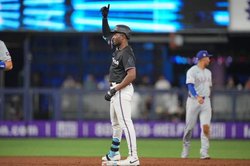 May 31, 2024; Miami, Florida, USA;  Miami Marlins right fielder Jesús Sánchez (12) celebrates a double in the second inning against the Texas Rangers at loanDepot Park. Mandatory Credit: Jim Rassol-USA TODAY Sports