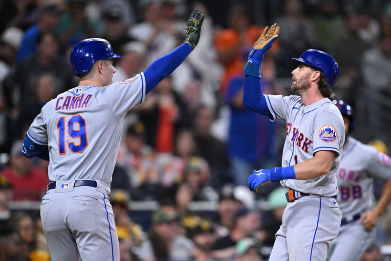 Jul 7, 2023; San Diego, California, USA; New York Mets second baseman Jeff McNeil (1) is congratulated by left fielder Mark Canha (19) after scoring a run against the San Diego Padres during the 10th inning at Petco Park. Mandatory Credit: Orlando Ramirez-USA TODAY Sports