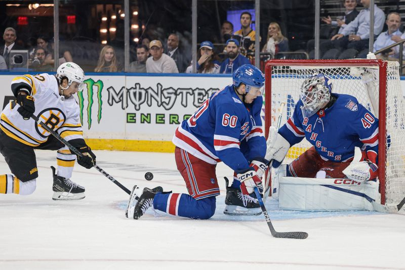 Sep 23, 2025; New York, New York, USA; Boston Bruins center Marat Khusnutdinov (92) scores a goal past New York Rangers goaltender Talyn Boyko (40) during the third period of a preseason game at Madison Square Garden. Mandatory Credit: Vincent Carchietta-Imagn Images