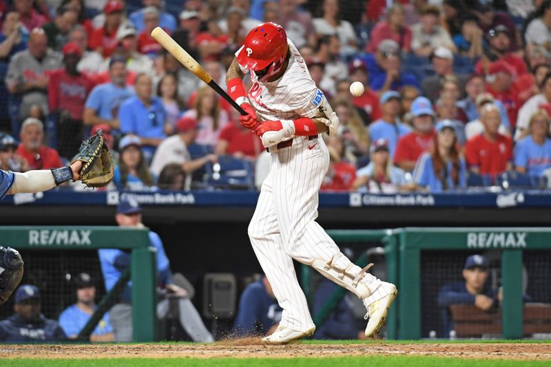 Sep 10, 2024; Philadelphia, Pennsylvania, USA; Philadelphia Phillies outfielder Nick Castellanos (8) gets hit by a pitch during the eighth inning against the Tampa Bay Rays at Citizens Bank Park. Mandatory Credit: Eric Hartline-Imagn Images