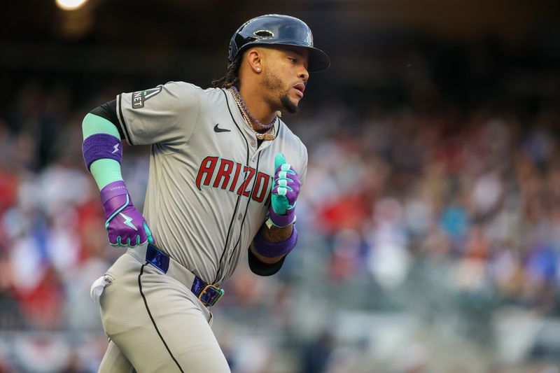 Apr 6, 2024; Atlanta, Georgia, USA; Arizona Diamondbacks second baseman Ketel Marte (4) rounds first after a home run against the Atlanta Braves in the first inning at Truist Park. Mandatory Credit: Brett Davis-USA TODAY Sports