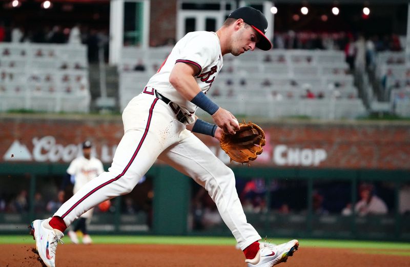 May 13, 2024; Cumberland, Georgia, USA; Atlanta Braves third base Zack Short (59) fields a grounder against the Chicago Cubs during the seventh inning at Truist Park. Mandatory Credit: John David Mercer-USA TODAY Sports