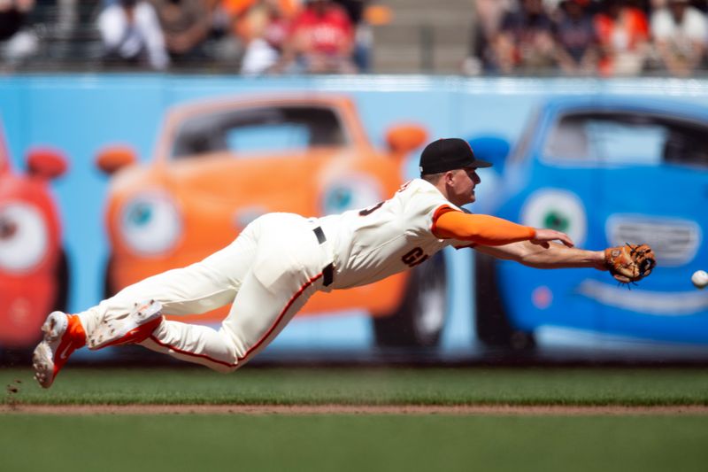 Aug 21, 2024; San Francisco, California, USA; San Francisco Giants third baseman Matt Chapman (26) dives in vain for a two-RBI single by Chicago White Sox third baseman Lenyn Sosa during the ninth inning at Oracle Park. Mandatory Credit: D. Ross Cameron-USA TODAY Sports