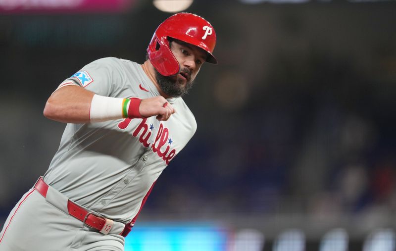 Sep 7, 2024; Miami, Florida, USA; Philadelphia Phillies designated hitter Kyle Schwarber (12) rounds third base and scores a run on a single in the first inning against the Miami Marlins at loanDepot Park. Mandatory Credit: Jim Rassol-Imagn Images