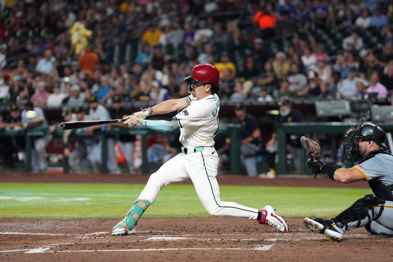 Jul 26, 2024; Phoenix, Arizona, USA; Arizona Diamondbacks outfielder Corbin Carroll (7) hits a triple against the Pittsburgh Pirates during the third inning at Chase Field. Mandatory Credit: Joe Camporeale-USA TODAY Sports