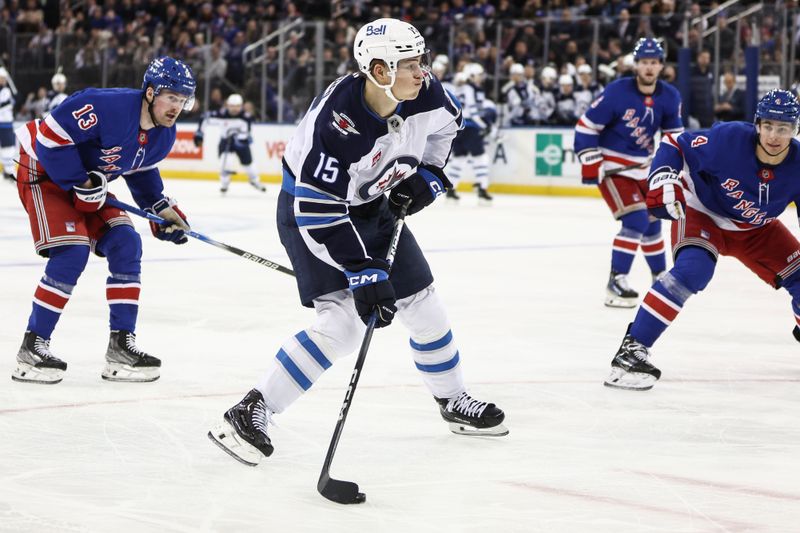 Nov 12, 2024; New York, New York, USA;  Winnipeg Jets center Rasmus Kupari (15) attempts a shot on goal in the third period against the New York Rangers at Madison Square Garden. Mandatory Credit: Wendell Cruz-Imagn Images