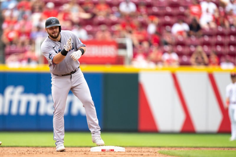 Aug 9, 2023; Cincinnati, OH, USA; Miami Marlins third baseman Jake Burger (36) gestures to the dugout after hitting a double in the ninth inning of the MLB baseball game between Cincinnati Reds and Miami Marlins at Great American Ball Park in Cincinnati on Wednesday, Aug. 9, 2023.  Mandatory Credit: Albert Cesare-USA TODAY Sports