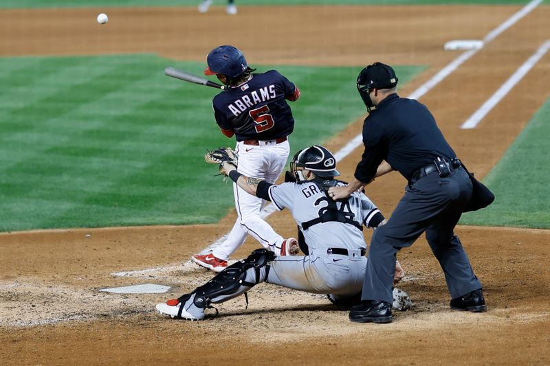 Sep 18, 2023; Washington, District of Columbia, USA; Washington Nationals shortstop CJ Abrams (5) hits a double against the Chicago White Sox during the eighth inning at Nationals Park. Mandatory Credit: Geoff Burke-USA TODAY Sports