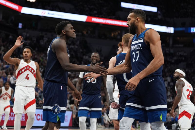 MINNEAPOLIS, MN -  OCTOBER 22: Rudy Gobert #27 and Anthony Edwards #5 of the Minnesota Timberwolves high five after the game against the Toronto Raptors on October 22, 2024 at Target Center in Minneapolis, Minnesota. NOTE TO USER: User expressly acknowledges and agrees that, by downloading and or using this Photograph, user is consenting to the terms and conditions of the Getty Images License Agreement. Mandatory Copyright Notice: Copyright 2024 NBAE (Photo by Jordan Johnson/NBAE via Getty Images)