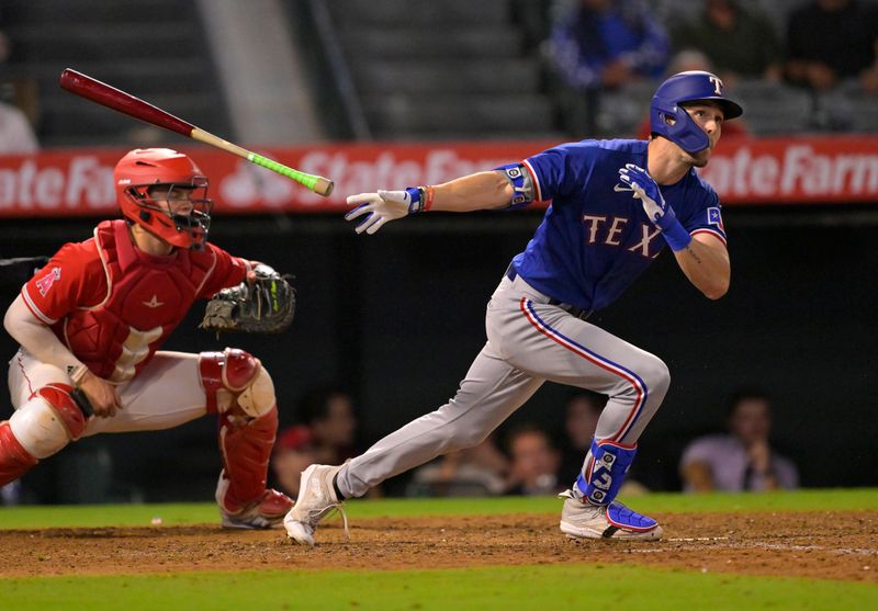 Sep 27, 2023; Anaheim, California, USA; Texas Rangers center fielder Evan Carter (32) hits a two run home run in the ninth inning against the Los Angeles Angels at Angel Stadium. Mandatory Credit: Jayne Kamin-Oncea-USA TODAY Sports