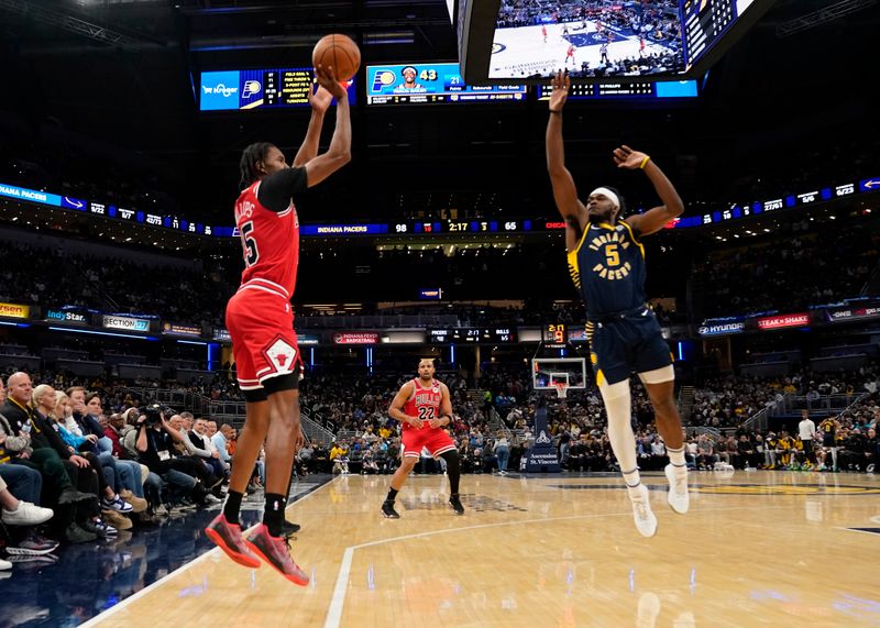 INDIANAPOLIS, INDIANA - JANUARY 08: Julian Phillips #15 of the Chicago Bulls shoots against Jarace Walker #5 of the Indiana Pacers during an NBA basketball game at Gainbridge Fieldhouse on January 08, 2025 in Indianapolis, Indiana. NOTE TO USER: User expressly acknowledges and agrees that, by downloading and or using this Photograph, user is consenting to the terms and conditions of the Getty Images License Agreement. (Photo by Jeff Dean/Getty Images)