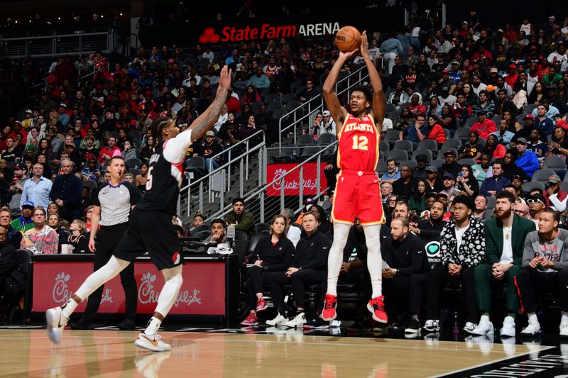 ATLANTA, GA - MARCH 3: De'Andre Hunter #12 of the Atlanta Hawks shoots the ball during the game against the Portland Trail Blazers on March 3, 2023 at State Farm Arena in Atlanta, Georgia.  NOTE TO USER: User expressly acknowledges and agrees that, by downloading and/or using this Photograph, user is consenting to the terms and conditions of the Getty Images License Agreement. Mandatory Copyright Notice: Copyright 2023 NBAE (Photo by Scott Cunningham/NBAE via Getty Images)