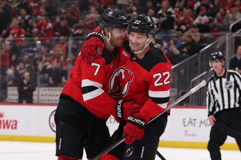 Jan 29, 2026; Newark, New Jersey, USA; New Jersey Devils defenseman Dougie Hamilton (7) and defenseman Brett Pesce (22) celebrate Hamilton’s goal against the Nashville Predators during the second period at Prudential Center. Mandatory Credit: Ed Mulholland-Imagn Images