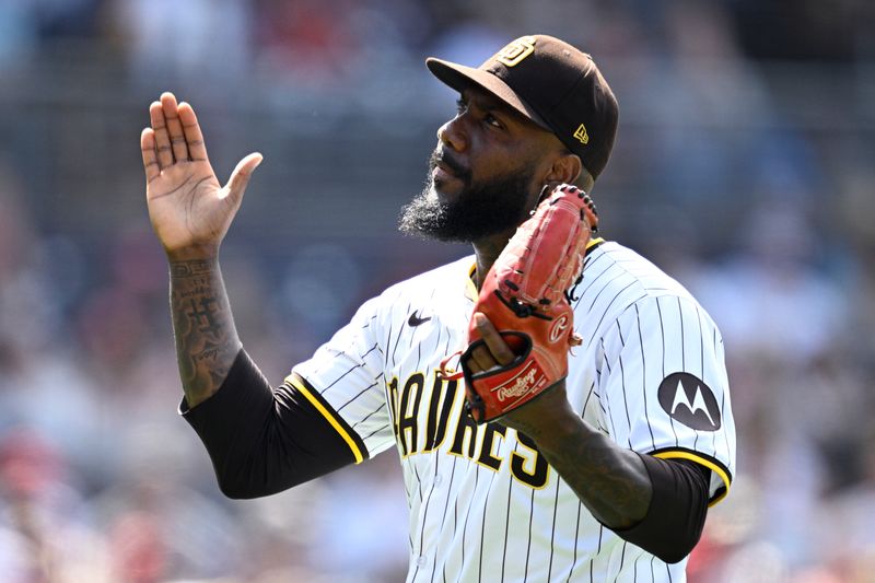 May 1, 2024; San Diego, California, USA; San Diego Padres relief pitcher Enyel De Los Santos (62) reacts after a strikeout to end the top of the seventh inning against the Cincinnati Reds at Petco Park. Mandatory Credit: Orlando Ramirez-USA TODAY Sports