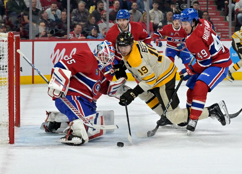 Mar 14, 2024; Montreal, Quebec, CAN; Montreal Canadiens goalie Sam Montembeault (35) stops Boston Bruins forward John Beecher (19) during the first period at the Bell Centre. Mandatory Credit: Eric Bolte-USA TODAY Sports