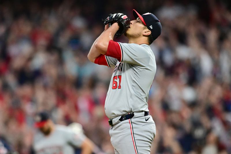 May 31, 2024; Cleveland, Ohio, USA; Washington Nationals relief pitcher Robert Garcia (61) reacts after giving up a three run home run to Cleveland Guardians catcher David Fry (not pictured) during the seventh inning at Progressive Field. Mandatory Credit: Ken Blaze-USA TODAY Sports