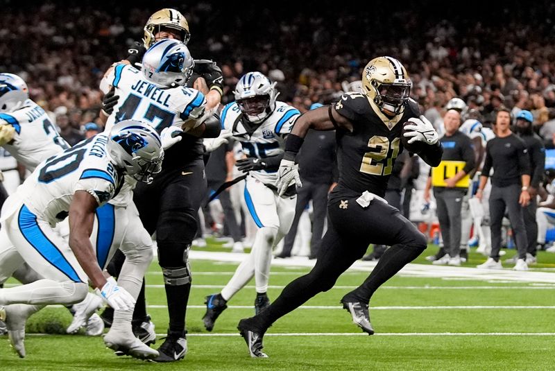 New Orleans Saints running back Jamaal Williams (21) runs into the end zone for a touchdown against the Carolina Panthers during the second half of an NFL football game Sunday, Sept. 8, 2024, in New Orleans. (AP Photo/Gerald Herbert)