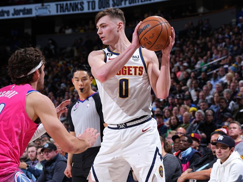 DENVER, CO - DECEMBER 14: Christian Braun #0 of the Denver Nuggets looks to pass the ball during the game against the Washington Wizards on December 14, 2022 at the Ball Arena in Denver, Colorado. NOTE TO USER: User expressly acknowledges and agrees that, by downloading and/or using this Photograph, user is consenting to the terms and conditions of the Getty Images License Agreement. Mandatory Copyright Notice: Copyright 2022 NBAE (Photo by Garrett Ellwood/NBAE via Getty Images)