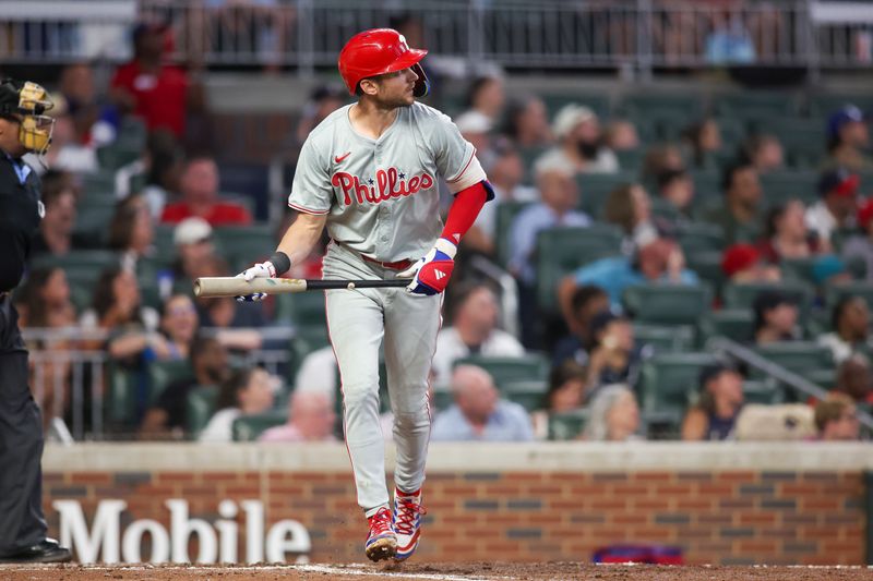 Jul 5, 2024; Atlanta, Georgia, USA; Philadelphia Phillies shortstop Trea Turner (7) hits a two-run home run against the Atlanta Braves in the sixth inning at Truist Park. Mandatory Credit: Brett Davis-USA TODAY Sports