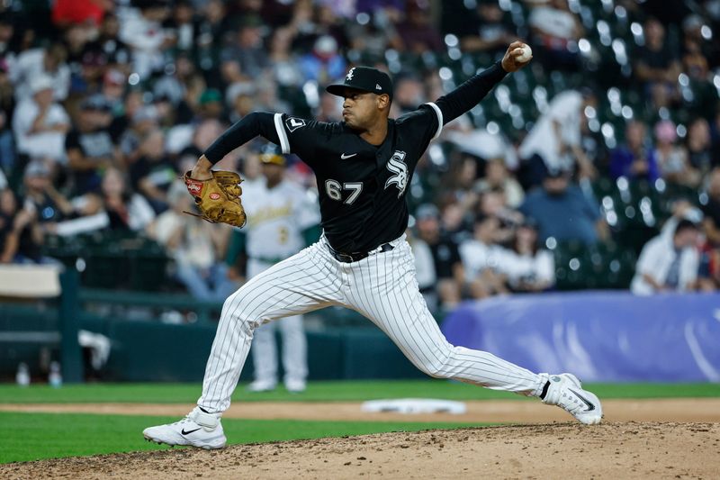 Aug 26, 2023; Chicago, Illinois, USA; Chicago White Sox relief pitcher Sammy Peralta (67) delivers a pitch against the Oakland Athletics during the eight inning at Guaranteed Rate Field. Mandatory Credit: Kamil Krzaczynski-USA TODAY Sports