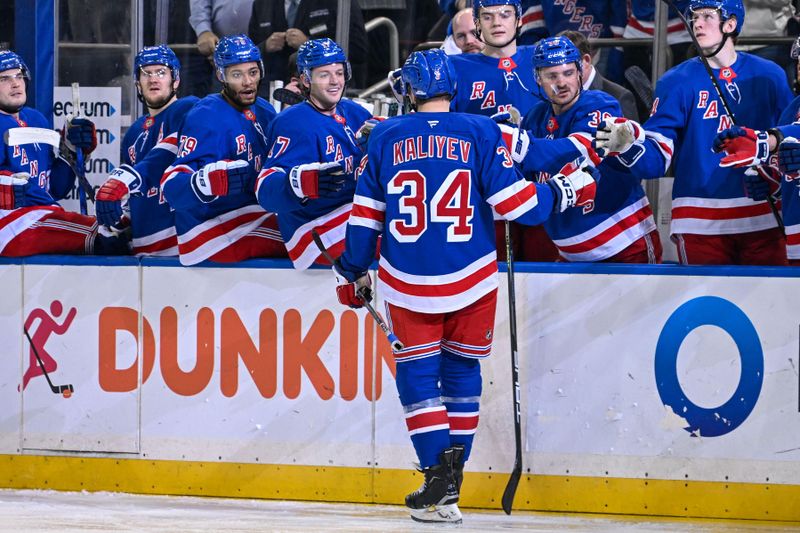 Jan 21, 2025; New York, New York, USA;  New York Rangers right wing Arthur Kaliyev (34) celebrates his goal against the Ottawa Senators during the second period at Madison Square Garden. Mandatory Credit: Dennis Schneidler-Imagn Images