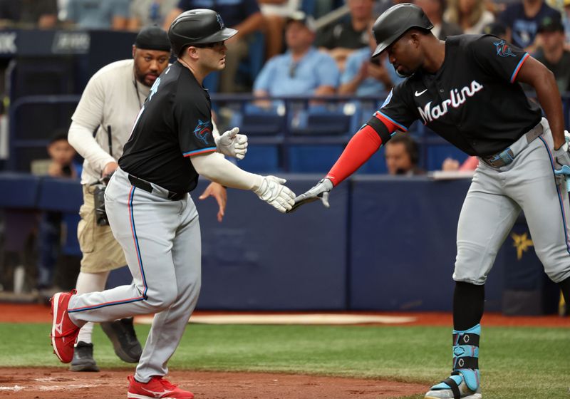Jul 31, 2024; St. Petersburg, Florida, USA; Miami Marlins third base Jonah Bride (41) celebrates with outfielder Jesus Sanchez (12) after hitting a home run against the Tampa Bay Rays during the second inning at Tropicana Field. Mandatory Credit: Kim Klement Neitzel-USA TODAY Sports