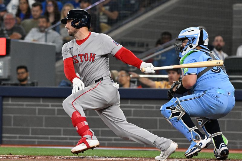 Sep 24, 2025; Toronto, Ontario, CAN;  Boston Red Sox third baseman Alex Bregman (2) hits a single against the Toronto Blue Jays in the first inning at Rogers Centre. Mandatory Credit: Dan Hamilton-Imagn Images