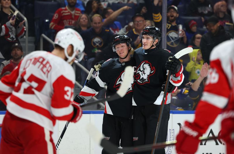 Oct 26, 2024; Buffalo, New York, USA;  Buffalo Sabres center Tage Thompson (72) celebrates his second goal of the game with defenseman Rasmus Dahlin (26) during the second period against the Detroit Red Wings at KeyBank Center. Mandatory Credit: Timothy T. Ludwig-Imagn Images