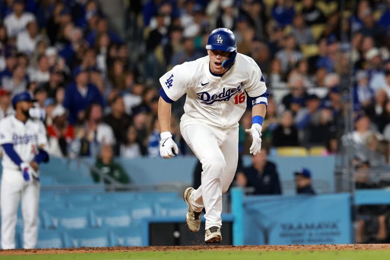 May 17, 2024; Los Angeles, California, USA;  Los Angeles Dodgers catcher Will Smith (16) hits an RBI single during the seventh inning against the Cincinnati Reds at Dodger Stadium. Mandatory Credit: Kiyoshi Mio-USA TODAY Sports