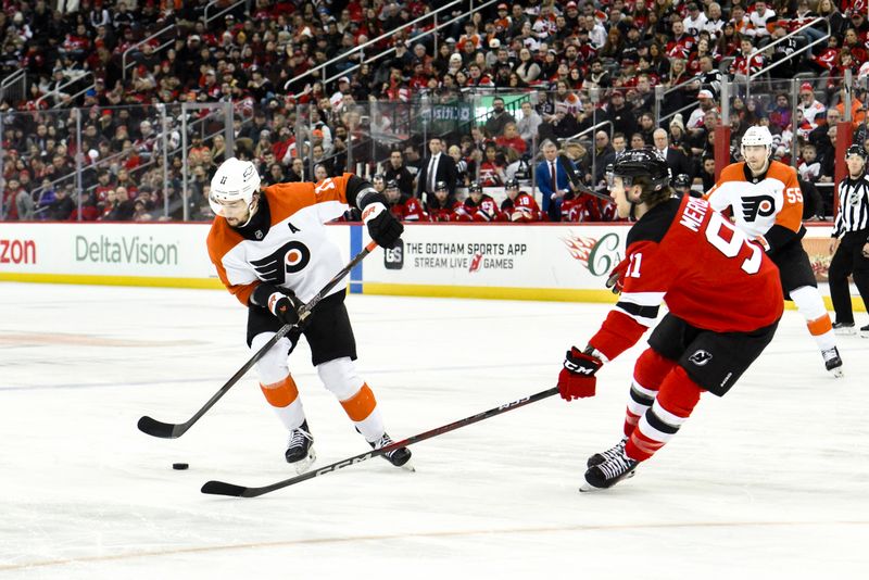 Jan 29, 2025; Newark, New Jersey, USA; Philadelphia Flyers right wing Travis Konecny (11) skates with the puck against New Jersey Devils center Dawson Mercer (91) during the second period at Prudential Center. Mandatory Credit: John Jones-Imagn Images